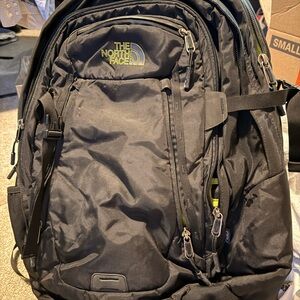 The North Face Black Backpack with Yellow Accents